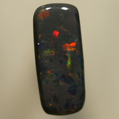 SOLID BLACK OPAL Sparkles of red between blues with a touch of gold
